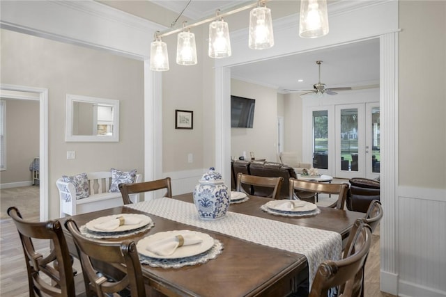 373 Harbour Island Cir, Waverly, GA 31565 - dining area with crown molding, ceiling fan, and a wainscoted wall