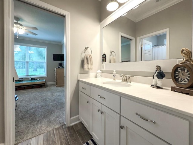 373 Harbour Island Cir, Waverly, GA 31565 - full bathroom with ornamental molding, vanity, wood finished floors, and ceiling fan