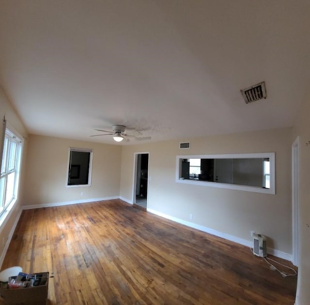 spare room with hardwood / wood-style flooring and ceiling fan