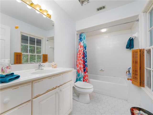 full bathroom featuring toilet, shower / tub combo, tile patterned flooring, and vanity