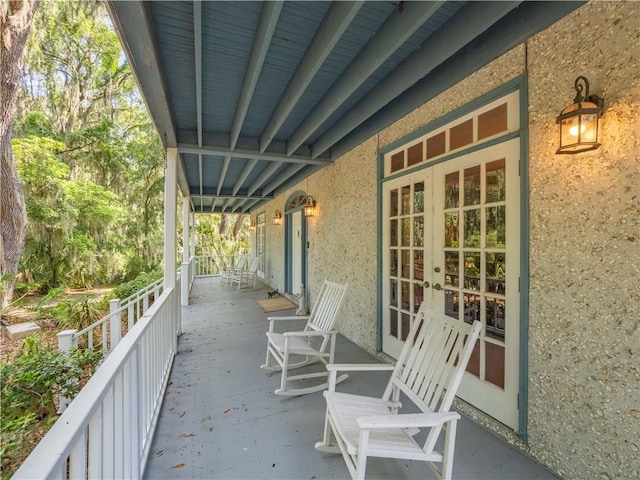 view of patio with covered porch and french doors