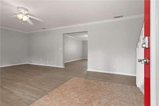 701 Third Ave, Saint Simons Island, GA 31522 - unfurnished room featuring crown molding, wood finished floors, baseboards, and ceiling fan