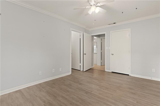 701 Third Ave, Saint Simons Island, GA 31522 - spare room with a ceiling fan, crown molding, light wood-style flooring, and visible vents