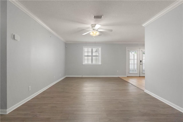 701 Third Ave, Saint Simons Island, GA 31522 - spare room featuring ceiling fan, ornamental molding, a wealth of natural light, and visible vents