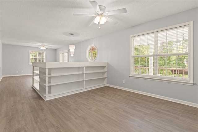 701 Third Ave, Saint Simons Island, GA 31522 - unfurnished room featuring a wealth of natural light, baseboards, and a ceiling fan