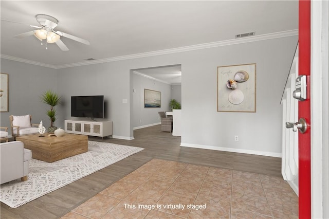 701 Third Ave, Saint Simons Island, GA 31522 - living area with wood finished floors, ornamental molding, visible vents, a ceiling fan, and baseboards