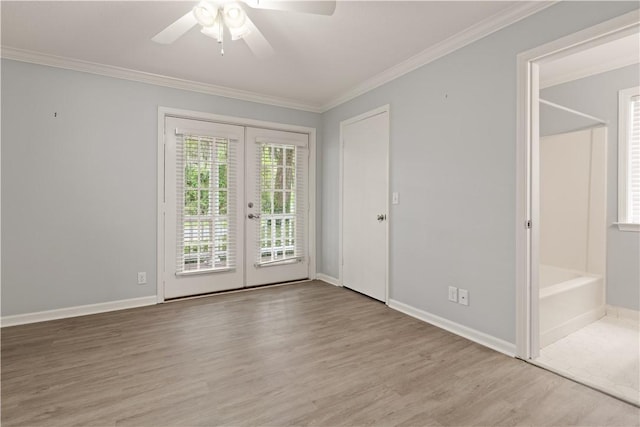 701 Third Ave, Saint Simons Island, GA 31522 - spare room with a ceiling fan, ornamental molding, french doors, and wood finished floors