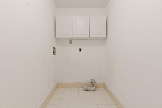701 Third Ave, Saint Simons Island, GA 31522 - clothes washing area featuring cabinet space, hookup for an electric dryer, tile patterned floors, baseboards, and hookup for a washing machine