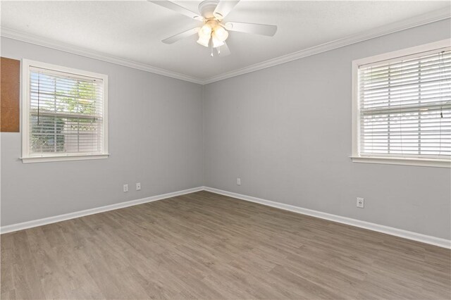 701 Third Ave, Saint Simons Island, GA 31522 - spare room featuring ceiling fan, wood finished floors, baseboards, and ornamental molding