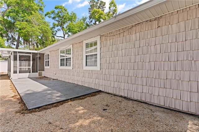 701 Third Ave, Saint Simons Island, GA 31522 - exterior space featuring a sunroom and a wooden deck