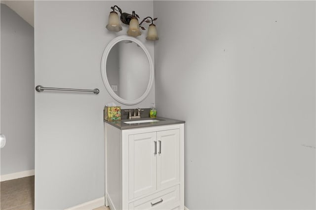 701 Third Ave, Saint Simons Island, GA 31522 - bathroom with vanity, baseboards, and tile patterned floors