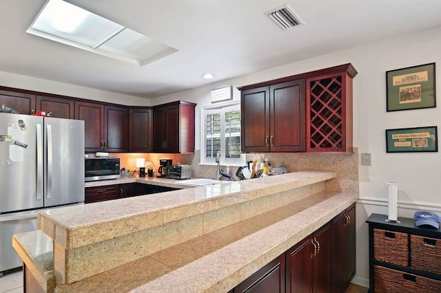 104 Cay Trce, Brunswick, GA 31525 - kitchen with appliances with stainless steel finishes, tasteful backsplash, tile countertops, a sink, and recessed lighting