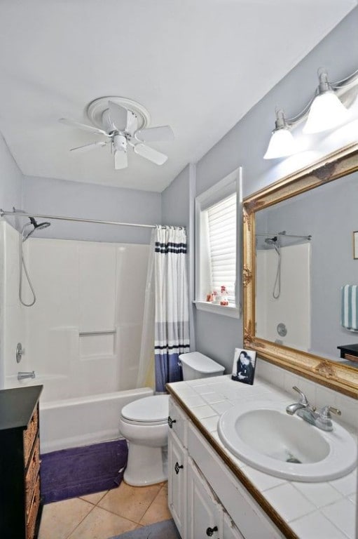 104 Cay Trce, Brunswick, GA 31525 - bathroom with vanity, toilet, shower / tub combo, tile patterned flooring, and ceiling fan