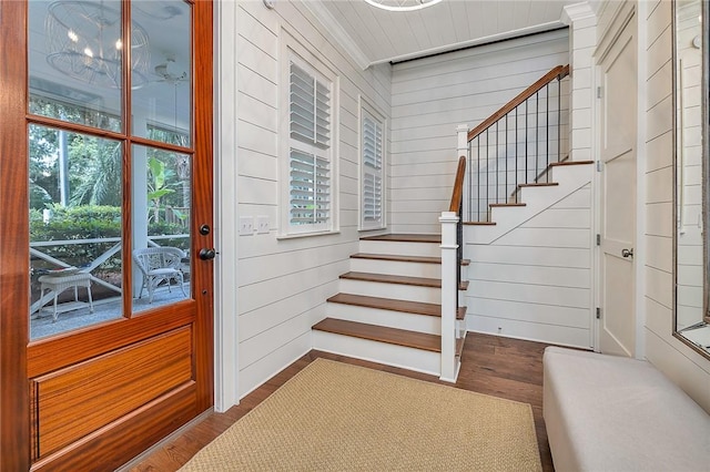 11826 Old Demere Rd, Saint Simons Island, GA 31522 - entryway featuring wood finished floors, stairway, and wooden walls