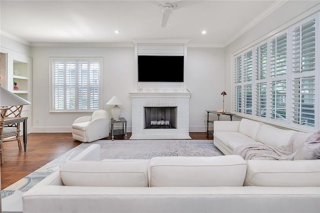 11826 Old Demere Rd, Saint Simons Island, GA 31522 - living room featuring crown molding, wood finished floors, a fireplace, and recessed lighting