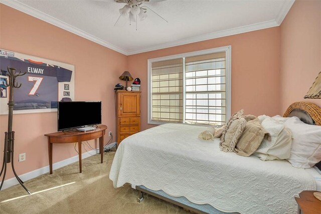 bedroom featuring carpet flooring, ceiling fan, and crown molding