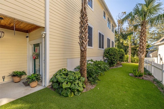 view of home's exterior with a yard