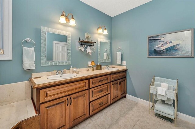 bathroom featuring tile patterned flooring and vanity