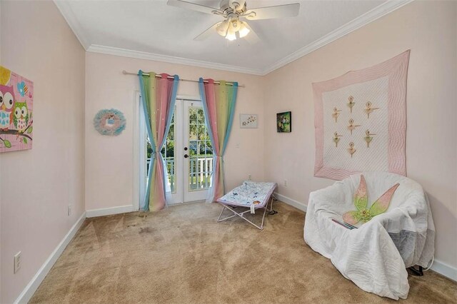 living area featuring crown molding, ceiling fan, and light carpet