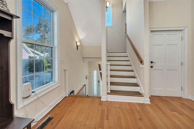 staircase with wood-type flooring