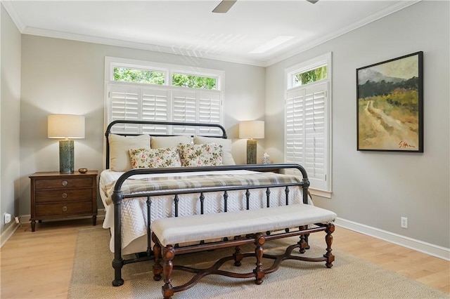 206 Dunbar Dr, Saint Simons Island, GA 31522 - bedroom featuring ornamental molding, wood finished floors, baseboards, and a ceiling fan