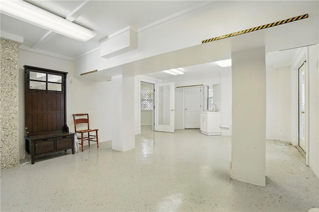 basement featuring plenty of natural light and a sink