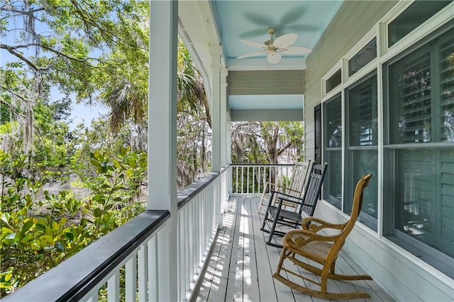 206 Dunbar Dr, Saint Simons Island, GA 31522 - balcony featuring a ceiling fan and a porch