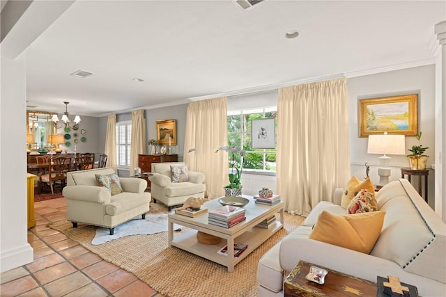 tiled living area with an inviting chandelier, ornamental molding, visible vents, and recessed lighting