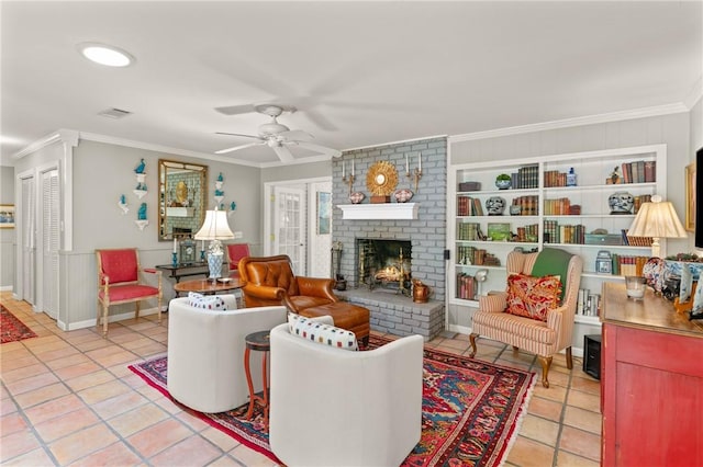 living room with crown molding, visible vents, a brick fireplace, ceiling fan, and light tile patterned floors