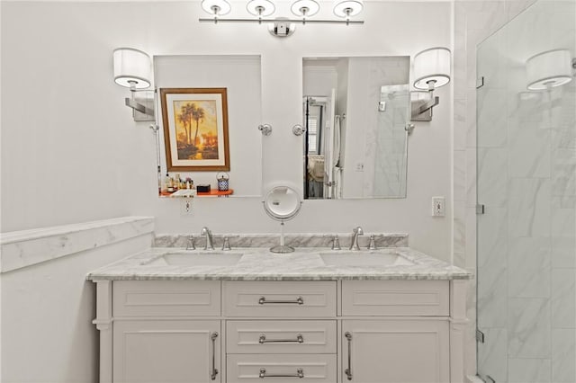 bathroom with double vanity, a sink, and a stall shower