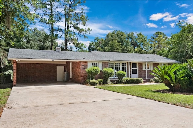 ranch-style home with a front lawn and a carport