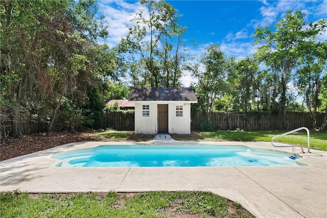 view of swimming pool featuring a storage shed