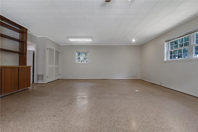 empty room featuring ornamental molding