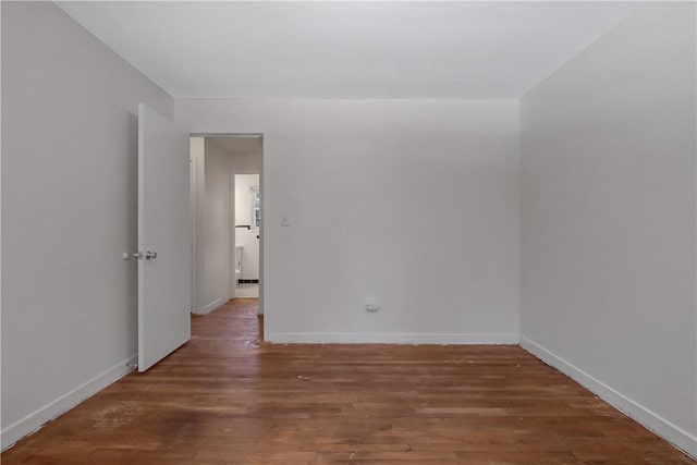 unfurnished room featuring hardwood / wood-style flooring