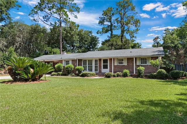 ranch-style home with a front lawn