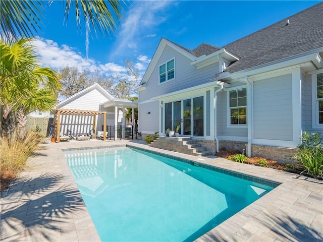 view of swimming pool with a patio, fence, a fenced in pool, and a gazebo