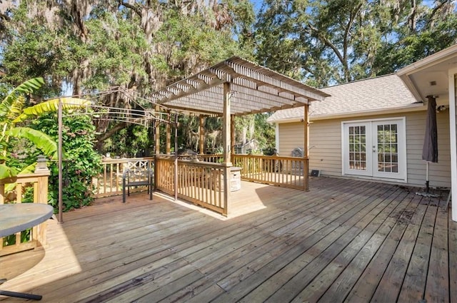 wooden deck with french doors and a pergola