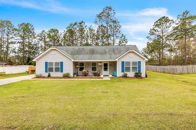 203 Hendrix St NE, Ludowici, GA 31316 - single story home featuring a front yard, covered porch, and fence