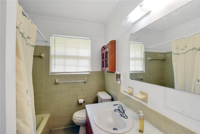 124 Ryals Rd, Brunswick, GA 31523 - bathroom with vanity, shower / bath combo with shower curtain, ornamental molding, and tile walls