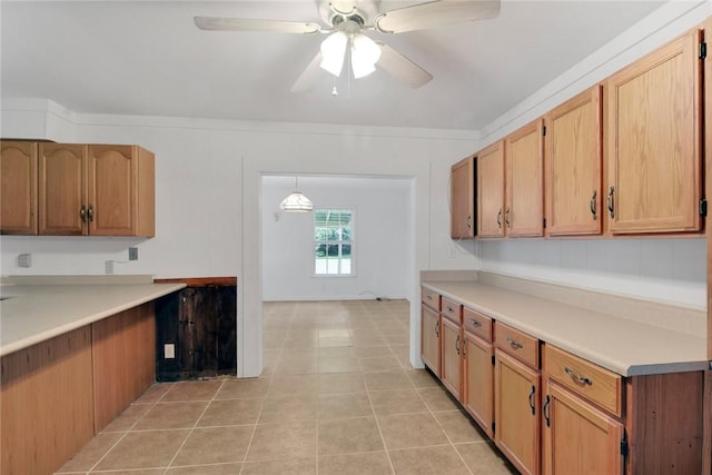 124 Ryals Rd, Brunswick, GA 31523 - kitchen with ceiling fan, light tile patterned floors, and light countertops
