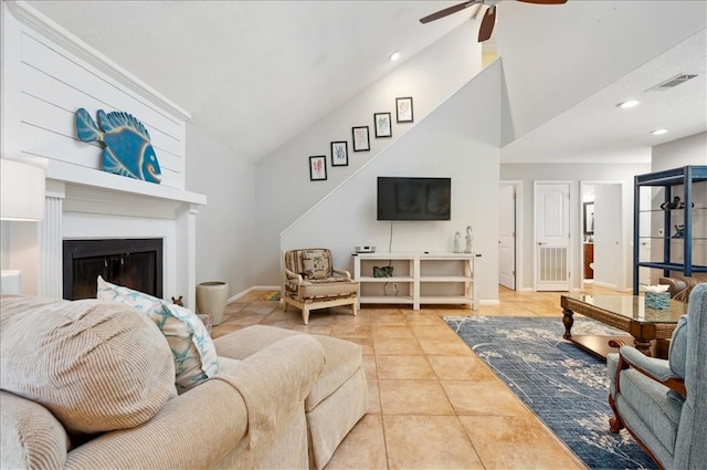 living area featuring a ceiling fan, lofted ceiling, baseboards, recessed lighting, and tile patterned floors
