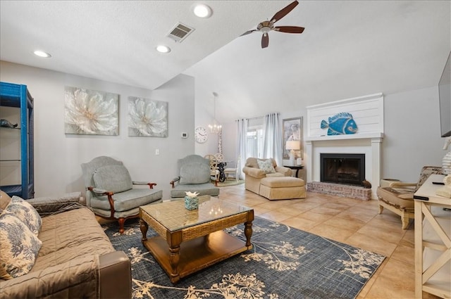 living area with ceiling fan, lofted ceiling, tile patterned floors, a fireplace, and recessed lighting