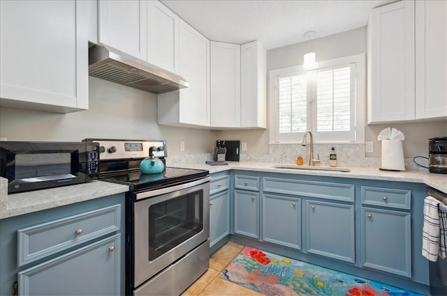 kitchen featuring stainless steel electric stove, exhaust hood, a sink, black microwave, and blue cabinets