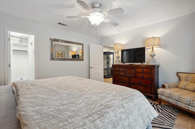 bedroom with a ceiling fan, a spacious closet, and a closet