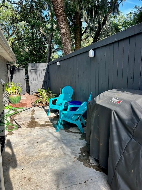 view of patio featuring a gate and a fenced backyard