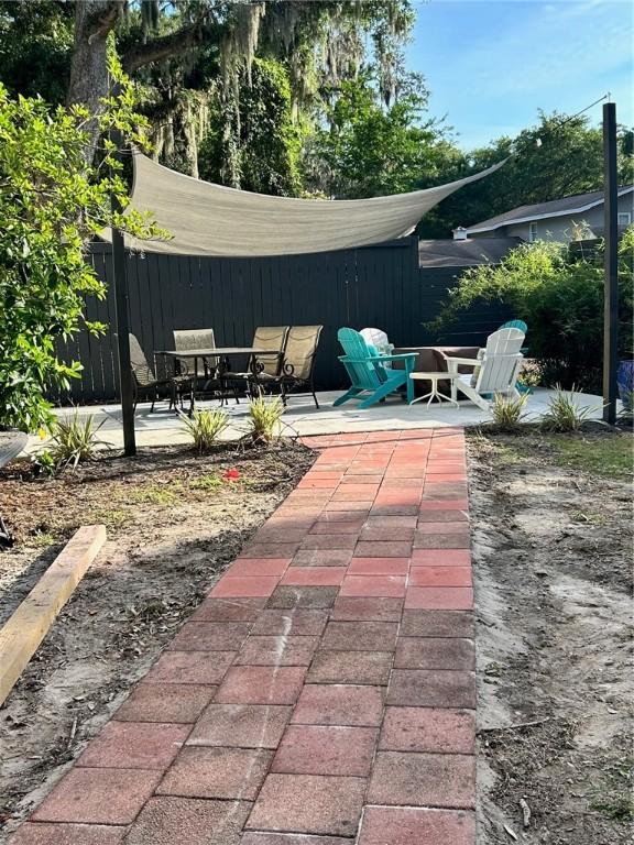 view of patio featuring fence