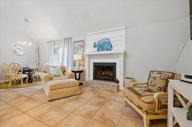 living area with a chandelier, vaulted ceiling, a fireplace, and light tile patterned flooring