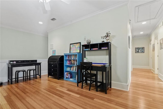 home office featuring wood-type flooring, ceiling fan, and crown molding