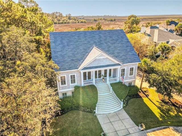 view of front of home featuring a front yard and a porch