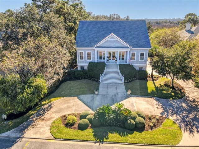 view of front of house featuring a front yard and covered porch